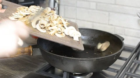 Process and cooking mushrooms for a dish Stock Footage 89128244