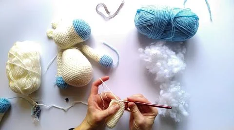 Process and materials for crocheting handmade unicorn toy Stock Photos