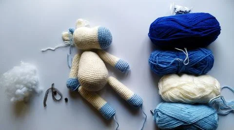 Process and materials for crocheting handmade unicorn toy Stock Photos