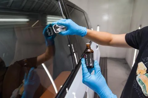The process of applying a nano-ceramic coating Ceramic Pro Rain, 9h and Light Stock Photos
