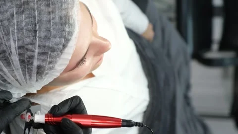 The process of applying permanent makeup to the lips. Vertical video Video stock 250384853