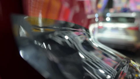 Process of applying a PPF film to a car. Close up footage of applying a film on Stock-Footage 294963661