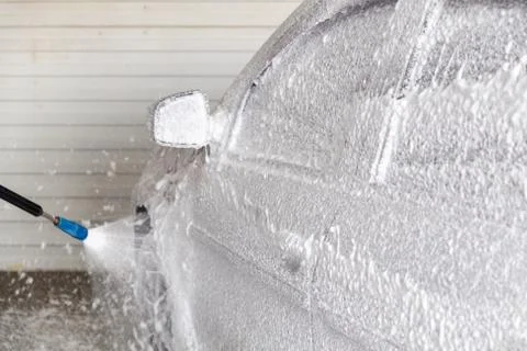 A process of applying soap sud in indoor carwash station - closeup with Photos
