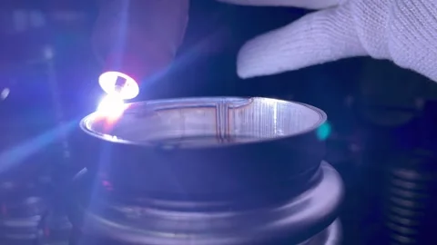 Process of argon welding flexible stainless steel pipe with nozzle close-up. Stock Footage 299779436