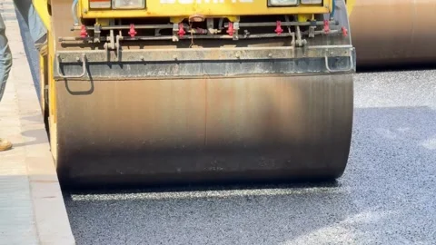 Process of asphalting, asphalt roller machine during construction and repairing Stock Footage 275611733