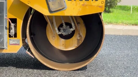 Process of asphalting, asphalt roller machine during construction and repairing Stock Footage 275611751