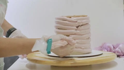 The process of assembling and decorating a cake Stock Footage 297778027