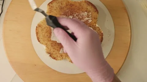 The process of assembling and decorating a cake by confectioner Stock Footage 310265984