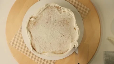 The process of assembling and decorating a cake by confectioner Stock Footage 310265989