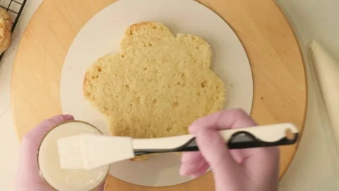 Process of assembling and decorating a cake by confectioner Stock Footage 314547759