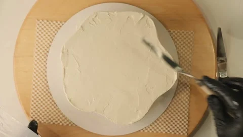The process of assembling and decorating a cake by confectioner Stock Footage 320132017