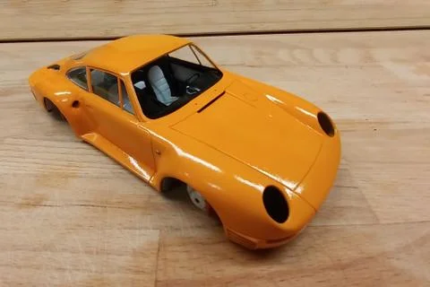 The process of assembling and painting the scale model of the car. Engine and Stock-Fotos