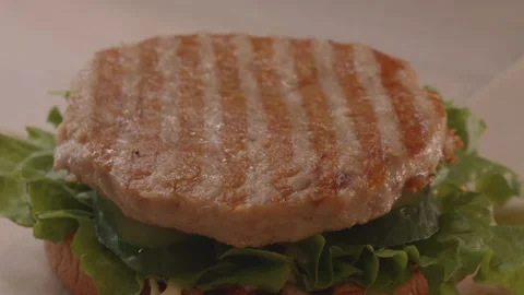 Process of assembling burger on restaurant kitchen. Stock Footage 312789633