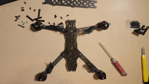 Process of assembling FPV drones with various technical components laid out.. Stock Footage 318032267