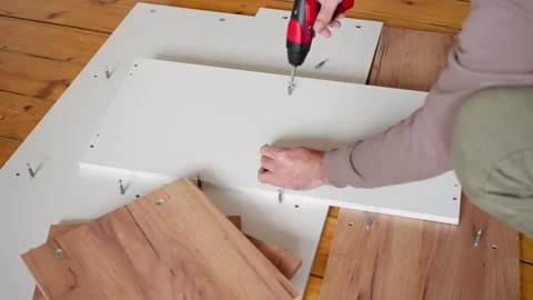 The process of assembling wooden panels for various types of furniture Stock Footage 302658747