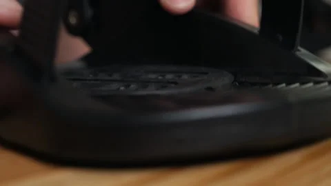 The process of attaching bindings to your snowboard at home. Prepares the Stock Footage 139942354