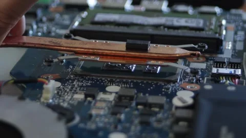 The process of attaching the cooling system to the laptop processor. A cooling Stock Footage 297070945