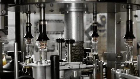 Process of attaching the cork to champagne bottles. Stock Footage 288410988