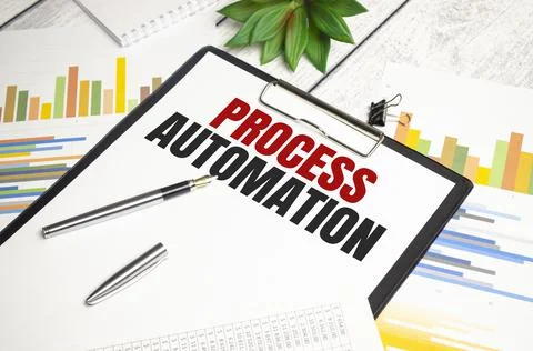 PROCESS AUTOMATION text on file folder and charts on wooden background Stockfoto's