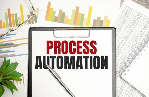 PROCESS AUTOMATION text on file folder and charts on wooden background 스톡 사진