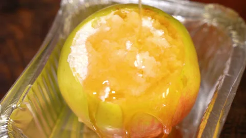 Process of baking a baked apple with cottage cheese, drizzled with honey Stock Footage 250014552