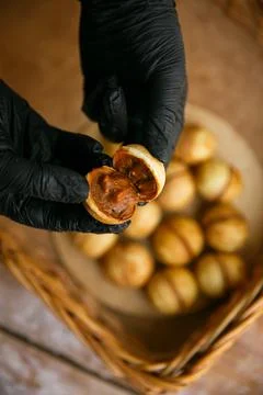 Process of baking homemade nuts filled with condensed milk. A traditional des Stock Photos