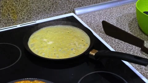 Process of baking thin pancakes on a hot frying pan. Stock Footage 258088478