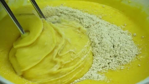 Process of beating eggs and flour for dough with hand mixer, close up Stock Footage 233518739