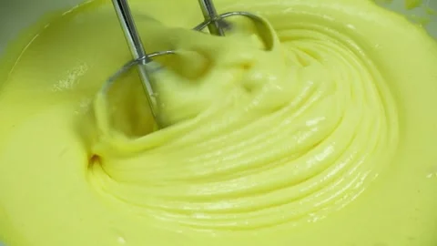 Process of beating eggs with sugar, the mixture becomes fluffy Stock Footage 233518632