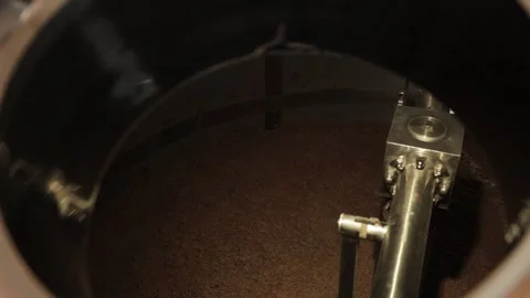 The process of beer fermentation, mixing barley in a barrel Stock Footage 252881300