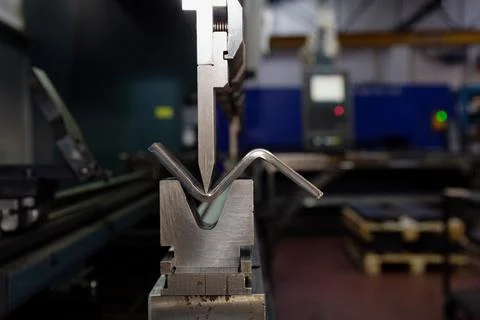 The process of bending galvanized sheet metal 2 millimeters thick on a specia Stock Photos