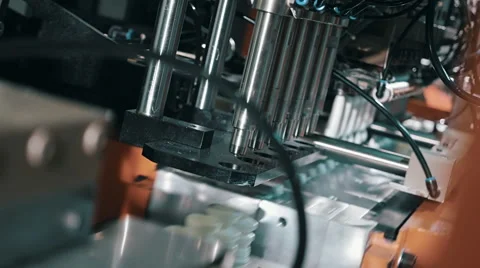 The process of blowing plastic bottles in extrusion equipment Stock Footage 61549342