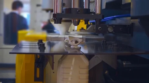 The process of blowing plastic containers in extrusion equipment Stock Footage 72352150