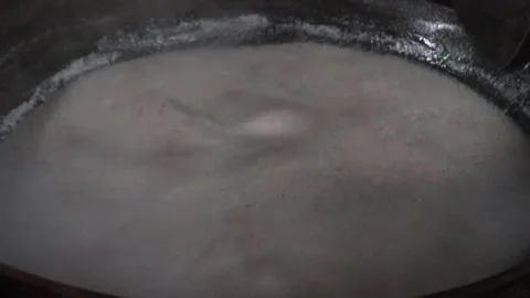 The process of boiling coconut milk to make oil. Stock Footage 218430220