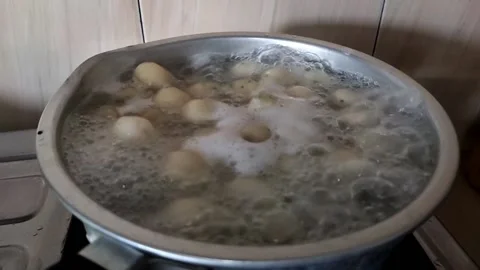 Process of boiling dough for Indonesian traditional meal called sempol Stock Footage 201006105