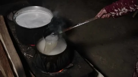 The process of boiling sap juice in a traditional kitchen takes hours Stock Footage 240071061