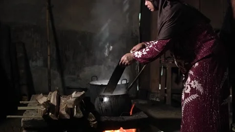 The process of boiling sap juice in a traditional kitchen takes hours Stock Footage 240071139