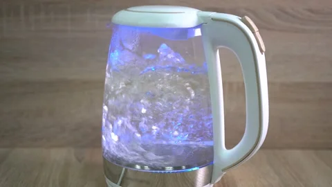 The process of boiling water. Making coffee in the morning. The electric kettle Video stock 166003193