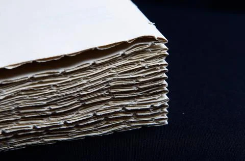 The process of book binding; close up of stacked paper folders. Stock Photos