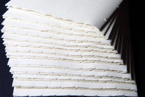 The process of book binding; pile of raw paper folders Stock Photos