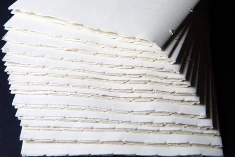 The process of book binding; pile of raw paper folders Stock Photos