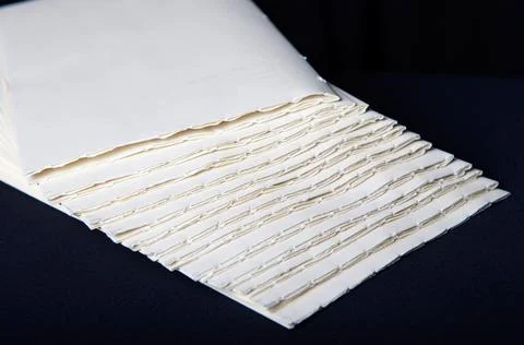 The process of book binding; putting together raw paper folders Stock Photos