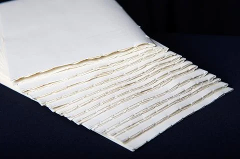 The process of book binding; putting together raw paper folders Stock Photos