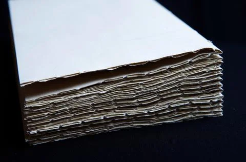 The process of book binding; stacked paper folders Stock Photos
