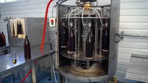 Process of bottling beverages on drinks production soft drinks, lemonade, beer Stock Footage 127309453