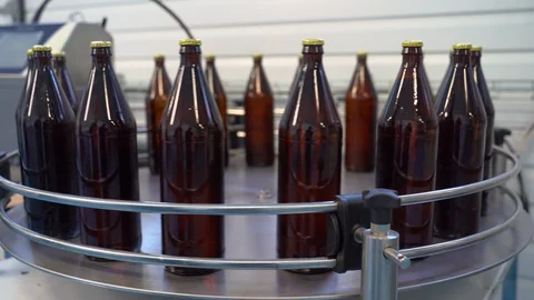Process of bottling beverages on drinks production soft drinks, lemonade, beer Stock Footage 127309645
