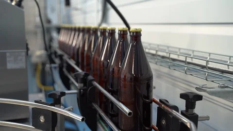 Process of bottling beverages on drinks production soft drinks, lemonade, beer Video stock 127309945