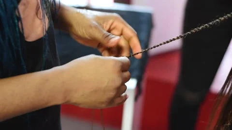 The process of braiding African braids on the mixed boy Video stock 164131799