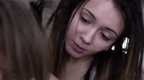 The process of braiding dreadlocks to young white guy Stock Footage 60363386