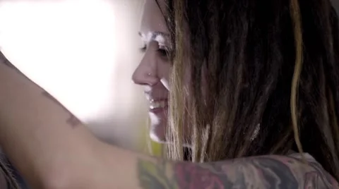 The process of braiding dreadlocks to young white guy Stock Footage 60363418